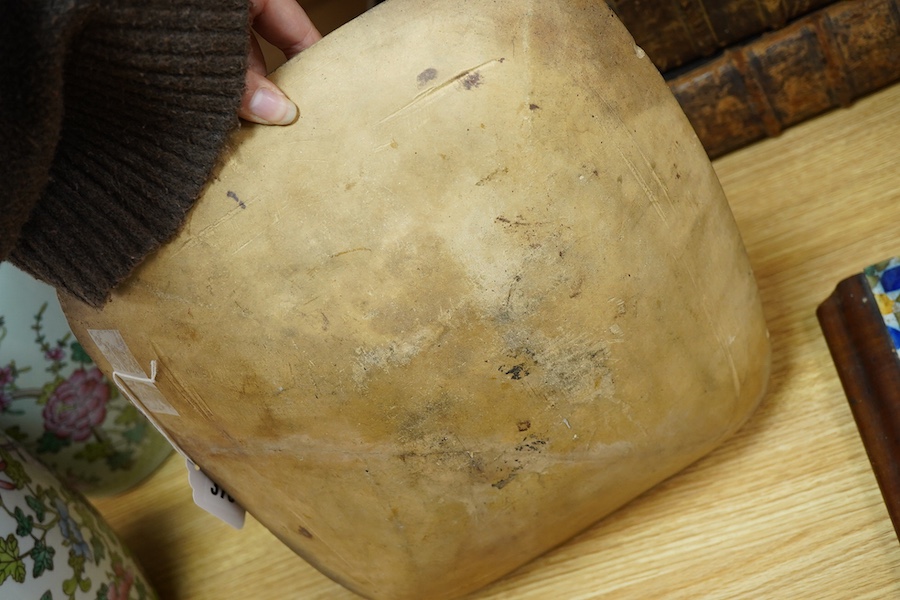 A 19th century pottery slipware baking dish (restored), 34cm wide and a Spanish maiolica tile